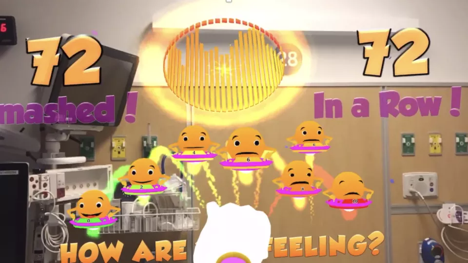 A screenshot image of the player's perspective playing the Magic Mallet AR game in a hospital room.