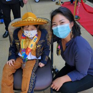 Nano and CHLA music therapist, Hana Cho, smiling together outside of the hospital